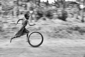 Child With Tyre, Uganda